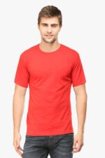 A man with short hair is modeling a plain red T-shirt from our "Shop the Best Plain T-Shirts for Men at Looga" collection. He pairs it effortlessly with blue jeans, standing against a crisp white background and facing forward.