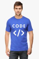 A man wearing the Techie's Classic T-Shirt, a blue tee featuring the word CODE and HTML tag symbols < >, stands against a plain white background. With short hair and jeans, he exudes a laid-back style reminiscent of a modern-day Looga coder.