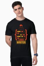 Wearing a Premium Programmer T-shirt from Looga's exclusive collection, someone stands against a plain backdrop. The black shirt showcases an illustration of a coder at their computer along with the bold orange and yellow text "CODE WRITER" while they look directly ahead.