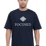 Trendy black OVERSIZED t-shirt with ‘FOCUSED’ logo and text design modeled by a stylish individual.