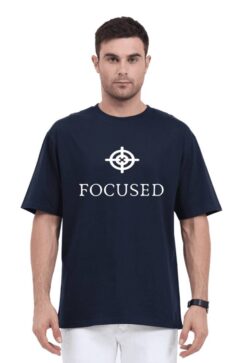 Trendy black OVERSIZED t-shirt with ‘FOCUSED’ logo and text design modeled by a stylish individual.