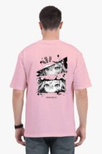 Someone is wearing a Unisex Oversized Anime T Shirt by Looga, featuring a pink color and back print with black and white character eye illustrations alongside the bold text Manga is my life.
