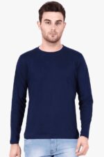 A person wearing a mens round neck full sleeve navy blue t-shirt, Loogas Ultimate Comfort and Style, paired with light blue jeans stands against a neutral background.