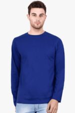 A South Asian male model with short hair, wearing a comfortable men's round neck full sleeve t-shirt in a neutral color