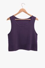 The Plain Color Crop Tank Top for Women by Looga, in a stylish purple, hangs gracefully on a wooden hanger against a light background.
