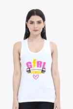 A woman confidently faces forward wearing a white tank top from Looga's Girls Power Gym collection, featuring the phrase "Girl Power" in bold pink and yellow alongside graphics of a lightning bolt and dumbbells. Her long dark hair elegantly frames her trendy hoop earrings, truly embodying stylish confidence with a touch of Looga flair.
