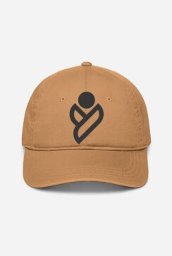 A tan baseball cap with a distinctive dark brown logo