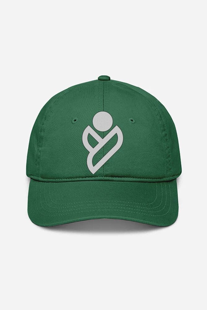 A Unisex Baseball Cap in green from Looga, featuring a white stylized logo consisting of a circular shape above a heart-like design on the front. The cap includes a curved brim and is photographed against a plain white background. A Unisex Baseball Cap in green from Looga, featuring a white stylized logo consisting of a circular shape above a heart-like design on the front. The cap includes a curved brim and is photographed against a plain white background.