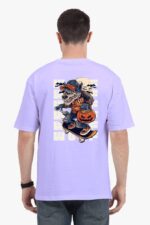 Someone wears an oversized lavender T-shirt from Looga, featuring a back print of a skateboarding wolf with a pumpkin and a spooky, moonlit scene.