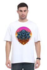 A man wearing the Perfect Oversize T Shirt in white displays a vibrant artistic lion design in blue and orange, inspired by a looga style, set against a colorful circular sunset backdrop. His short dark hair enhances his neutral expression.