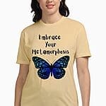 A woman in a casual beige women t shirt print featuring a blue butterfly