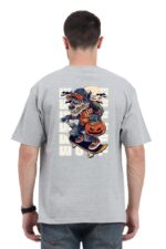 Someone is wearing a Looga Unisex Oversized Back Print T-shirt, featuring a cartoon wolf in a cap and shirt skateboarding with a Jack-o-lantern. The wolf, framed by bats and a full moon, enhances the shirts Halloween charm.