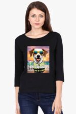 A woman with straight brown hair is wearing Loogas black Full-Sleeve Pet Lovers T-Shirt for Women, showcasing a dog in sunglasses at the beach labeled On Vacation. She stands against a plain background.