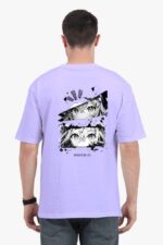 A man wearing a Looga unisex oversized anime T-shirt in lavender, featuring black-and-white manga-style facial expressions and the text Manga is my life on the back.