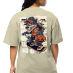 A South Asian model with short hair, wearing a relaxed-fit, oversized back print t-shirt in a neutral color with a bold graphic design printed