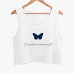 A white crop tank top with a blue butterfly graphic on the front, hanging on a wooden hanger against a plain background.