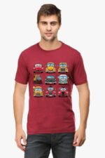 A man in a Looga Cartoon Cars T-shirt, featuring a playful grid of cars and trains, stands against a plain background, paired with cool dark jeans.