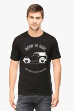 A man wearing the Thar Lovers T-Shirt with a car design and Born to Ride and Looga Wheels Move Your Soul text stands against a plain background.