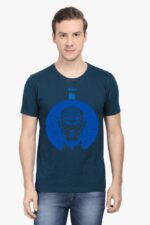 A person in a navy AI-Inspired T-Shirt by Looga, featuring a circuit-themed human graphic, stands against a white background. With short hair and blue jeans, they exude an enigmatic sense of futuristic style.