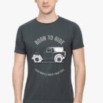 A South Asian male model with short hair, wearing a comfortable men's round neck Thar lovers t-shirt in a neutral color