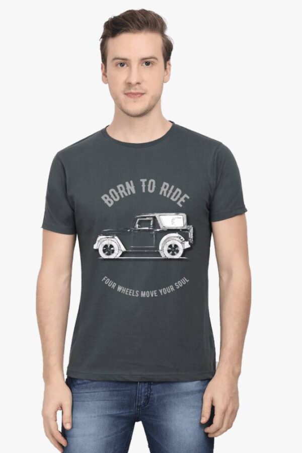 A South Asian male model with short hair, wearing a comfortable men's round neck Thar lovers t-shirt in a neutral color