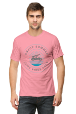 The image shows a person wearing a pink summer t-shirt with a graphic design on the front. The design includes text and an illustration of what appears to be a boat on water.