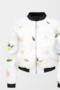A white bomber jacket for women with a black collar, cuffs, and hem featuring a floral pattern of pink daisies with yellow centers and green leaves. The jacket has a front zipper and two side pockets.