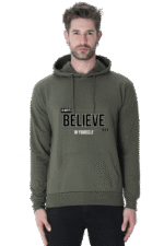 A man wears a Hooded Sweatshirt in olive green with Always Believe in Yourself on the front, giving off a relaxed, looga-inspired vibe.
