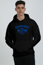 A person is confidently wearing an oversized black hoodie with blue text, Highschool 75 Varsity League, featuring a subtle Looga touch. They stand against a plain light gray background, showcasing comfort and style in one cozy package.