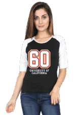 A woman with long hair is wearing a black and white raglan t-shirt featuring the number 60 and the words University of California. She is also wearing blue jeans and standing against a plain background.