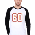 Man wearing a stylish white and black raglan T-shirt with the number 60 printed on it, paired with jeans.