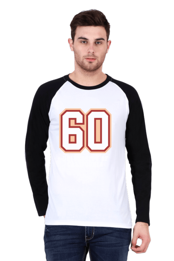 Man wearing a stylish white and black raglan T-shirt with the number 60 printed on it, paired with jeans.