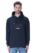 An individual stands against a white background, wearing the Hooded Sweatshirt - a navy blue hoodie with Always Believe in Yourself and a subtle logo design on the front, featuring a front pocket and drawstring hood.