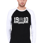 A man in a stylish raglan t-shirt stands against a plain background, his white and black shirt featuring the bold text "BORCELLE 19 10.