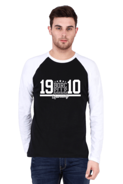 A man in a stylish raglan t-shirt stands against a plain background, his white and black shirt featuring the bold text "BORCELLE 19 10.