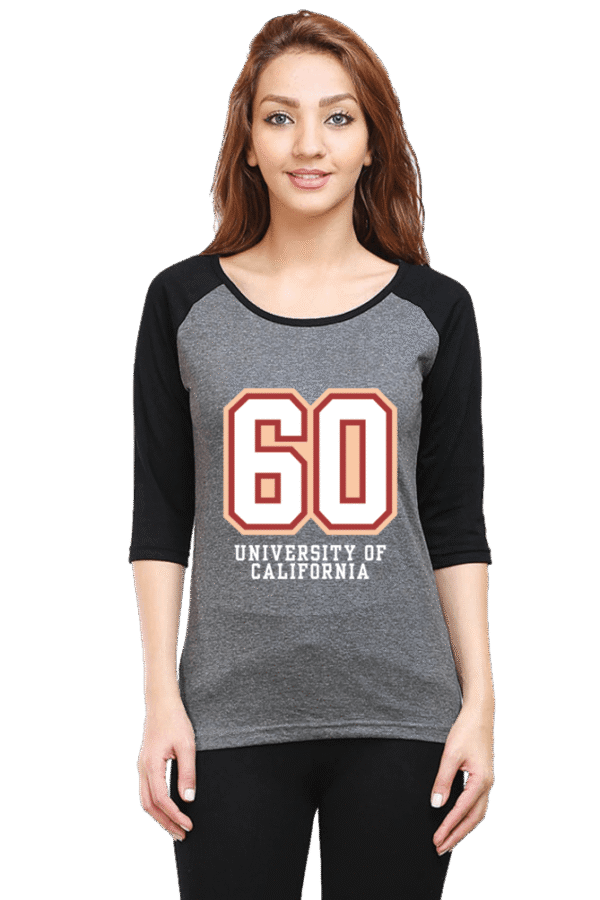 A person wearing a gray and black raglan shirt with the number 60 and University of California printed on the front. She is smiling and standing against a plain background.