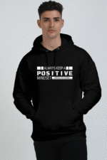 A person wearing a Unisex Oversized Hooded Sweatshirt - Comfortable & Stylish Hoodie for All, featuring the motivational message: Always keep a positive mindset, embrace the journey, echoing Loogas inspiring tales.