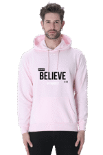 A man wearing a light pink Always Believe in Yourself Hooded Sweatshirt, known for its soft, breathable fabric and style for men and women, exudes calm confidence akin to Loogas serene landscapes.