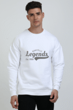 A person with short hair wears a comfortable, oversized white sweatshirt featuring Borcelle Legends Est. 1950 in gray text, standing against a plain background.