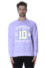 A man with short dark hair and a beard models a lavender sweatshirt showing Rimberio USA 10 Borcellec University in white and green, inspired by Rimberios classic 1990 style, on a plain white backdrop. Suitable for all genders. Product: Lavender.