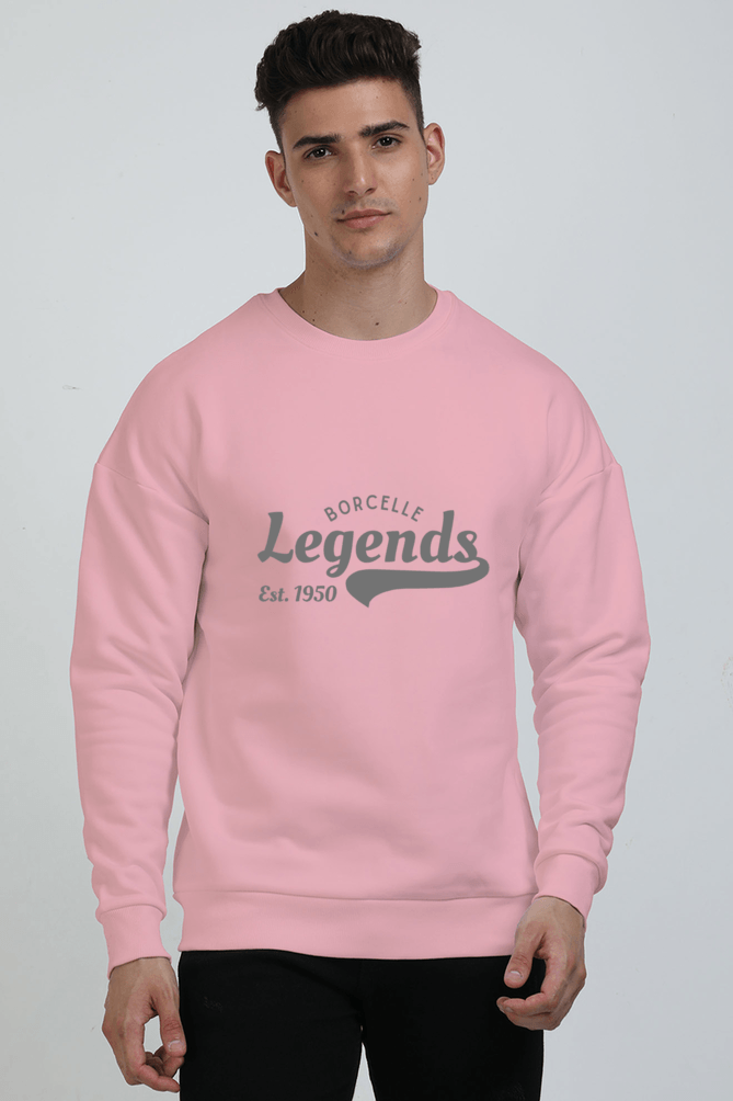 A person wearing a cozy oversized Light Baby Pink sweatshirt with Borcelle Legends Est. 1950 text, standing against a plain background. A person wearing a cozy oversized Light Baby Pink sweatshirt with Borcelle Legends Est. 1950 text, standing against a plain background.