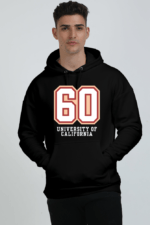 A person wearing a stylish heavyweight black hoodie with 60 University of California on the front stands out against a plain white background, highlighting its comfort and classic appeal.