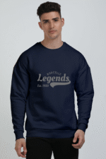 A person stands against a plain background wearing a comfortable oversized Navy Blue sweatshirt featuring the text Borcelle Legends Est. 1950.