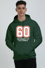 A person wearing a Bottle Green heavyweight hoodie with 60 University of California printed on the front stands against a plain background, perfectly blending style and comfort.