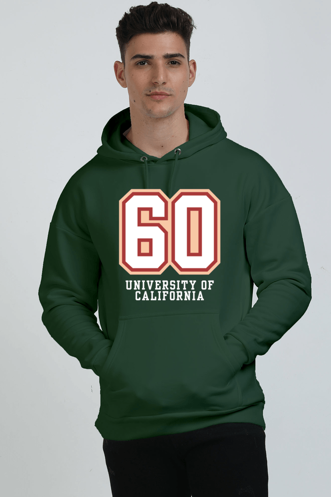 A person wearing a Bottle Green heavyweight hoodie with 60 University of California printed on the front stands against a plain background, perfectly blending style and comfort. A person wearing a Bottle Green heavyweight hoodie with 60 University of California printed on the front stands against a plain background, perfectly blending style and comfort.
