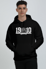 A person wearing an extra large black Black hoodie with 19 BORCELLE 10 on the front stands against a gray background.