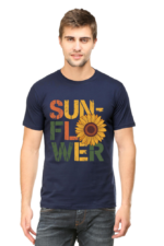 A man wearing Product, a navy blue T-shirt featuring the word SUNFLOWER in bold, colourful letters with a sunflower graphic as the "O".