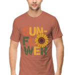 A man stands facing forward, wearing Product—a T-shirt with SUNFLOWER in bold, colourful letters and a large sunflower image replacing the O in FLOWER.