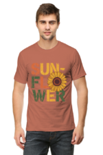 A man stands facing forward, wearing Product—a T-shirt with SUNFLOWER in bold, colourful letters and a large sunflower image replacing the O in FLOWER.
