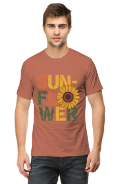A man stands facing forward, wearing Product—a T-shirt with SUNFLOWER in bold, colourful letters and a large sunflower image replacing the O in FLOWER.